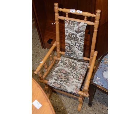 A vintage American style child's rocking chair