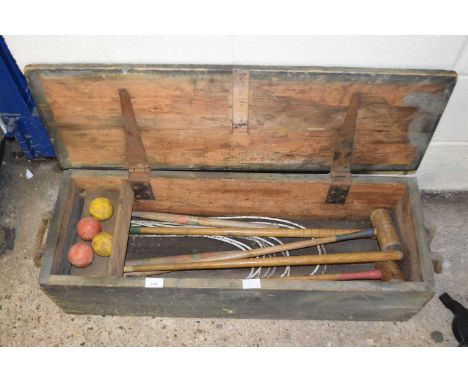 A vintage boxed croquet set