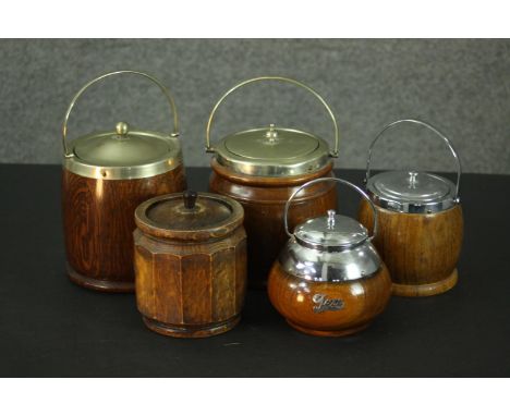 Five vintage chrome, silver plated and oak biscuit barrels and tea caddies, some with chrome name plaques. H.15 Dia.13cm (lar