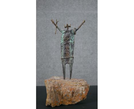 Bill Worrell, American, 1936, gilt and patinated bronze sculpture of an animal shaman mounted on a rock base. Signed Worrel, 