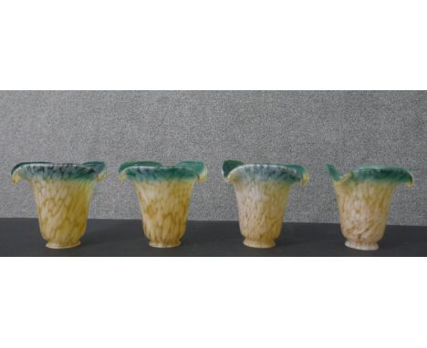 A set of four Art Nouveau Murano style marble glass bell shaped lamp shades with dark green rims and amber body. H.13 Diam.5c