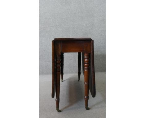 A 19th century mahogany drop leaf dining table, on ring turned gate legs. H.74 W.149 D.107cm 