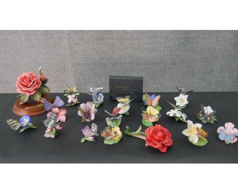 A collection of fifteen Franklin Mint 'Butterflies of the World' hand painted porcelain figures with identification cards and