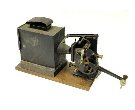 A W. C. Hughes & Co. Hand Crank Cine Projector, lacking lens and illuminate, AF