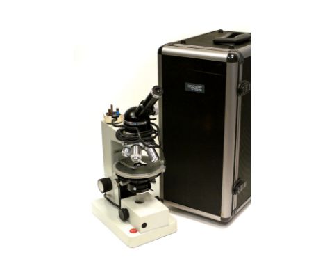 A Leitz HM-POL Microscope, with three Leitz objectives, in case
