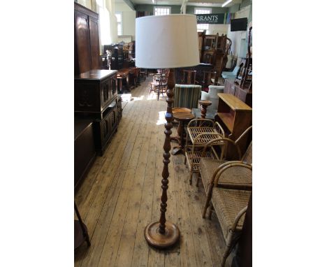 A mid 20th Century oak standard lamp