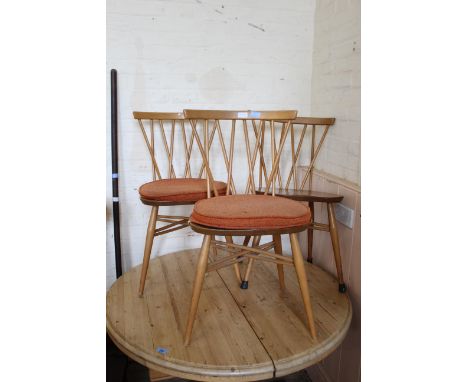A set of three candlestick back blonde Ercol chairs (one marked)
