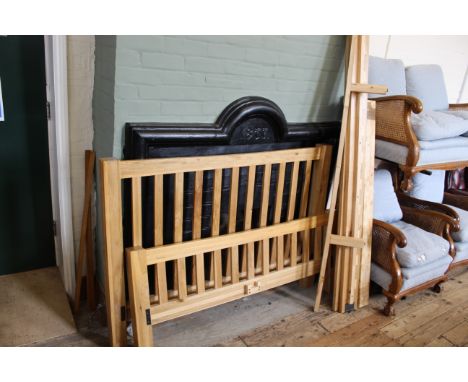 A modern light oak bed frame with side rails and slats, 5'