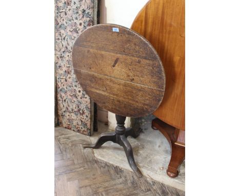 An early 19th Century oak tripod table
