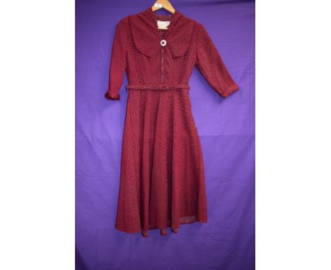 A late 1940s/early 1950s wool day dress in crimson with white dot pattern,Having Sylvern label, button detail to unusual neck