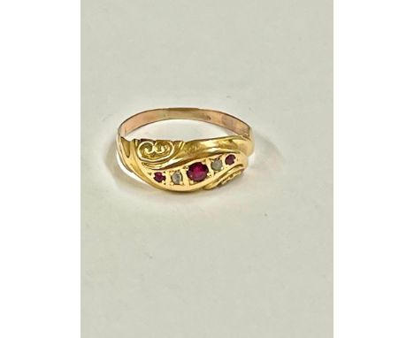 A high carat gold diamond and ruby gypsy set five stone ring size J    1.4 gms