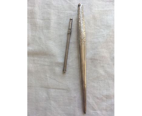 A swizzle stick and pen