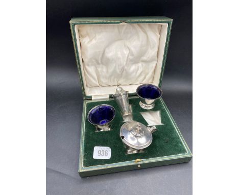 An Art Deco style four piece cruet set in fitted box, Sheffield 1934 by R&amp;B, 225g excluding BGL's