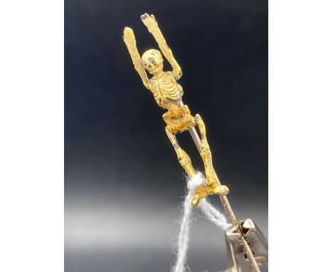 An unusual articulated skeleton stick pin