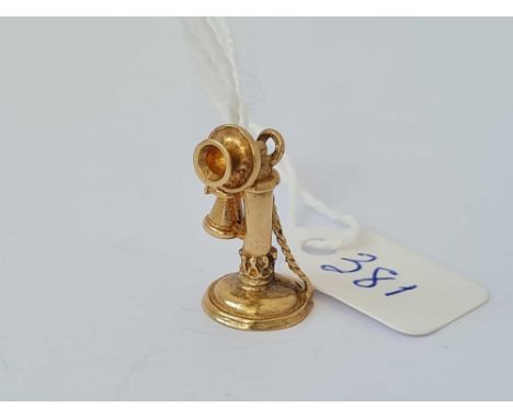A novelty charm in the form of a candlestick telephone 9ct  3.6 gms