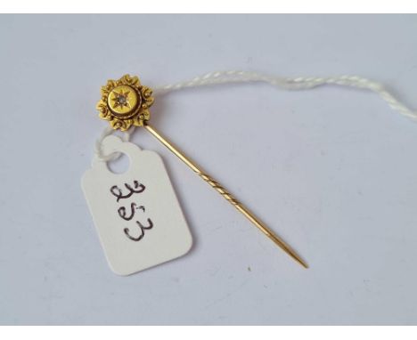 A stick pin with diamond top 15ct gold