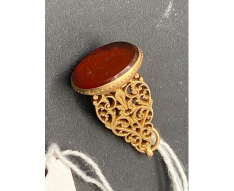A 19th century high carat gold eastern seal carnelian intaglio of flowers