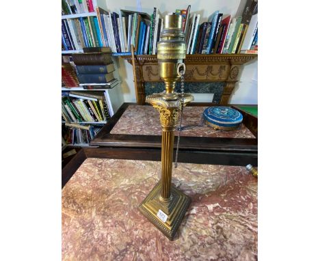 A brass table lamp with stepped square base, fluted stem, 16" high
