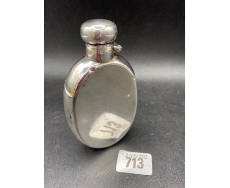 An Edwardian oval flask of curved outline, bayonet cover, 4.5" high, Birmingham 1910 by MB, 95g