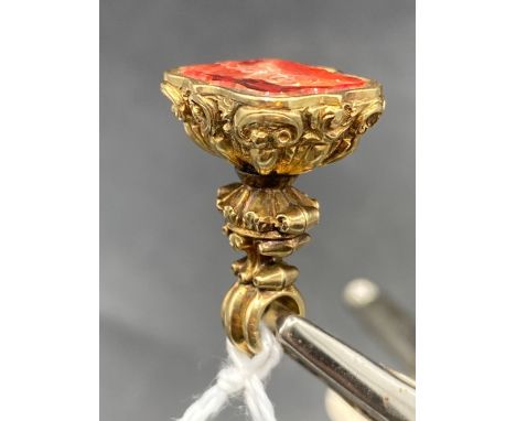 A 19th century fob seal inset with orange stone intaglio