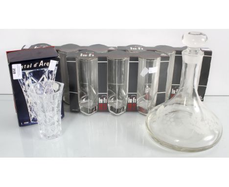 A group of assorted glass ware to include a decanter and tall drinking glasses