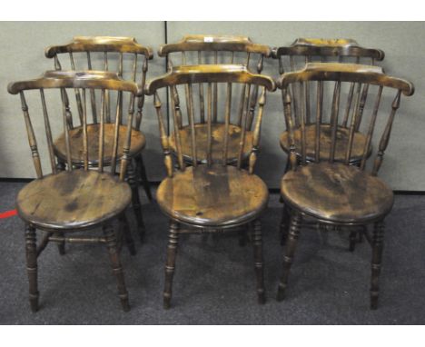 A set of six stick back chairs