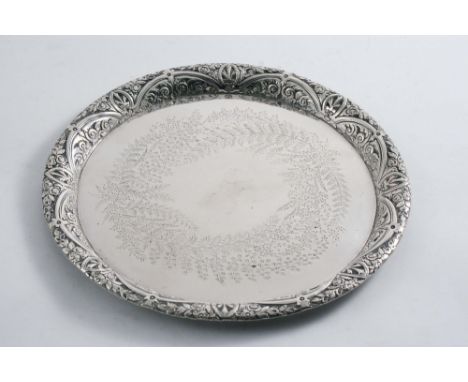 A VICTORIAN SMALL CIRCULAR SALVER OR TRAY with a chased, convex border & engraved ferns in the centre, by R. Martin & E. Hall