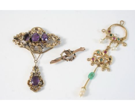 AN INDIAN GEM SET AND GOLD PENDANT 10cm. long, a 9ct. gold brooch, depicting a bird amongst foliate, 4.5cm. long, and a gold 