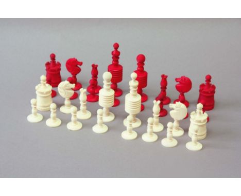 AN INDIAN TURNED RED AND WHITE BONE CHESS SET King 4ins. (10cms.) high