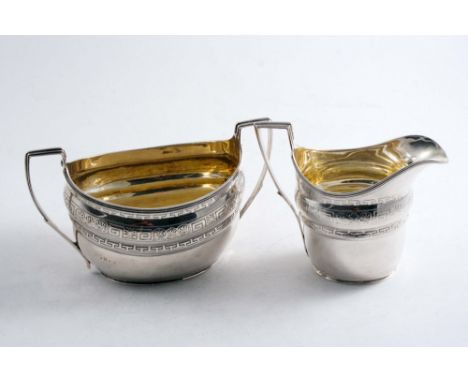 A GEORGE III ENGRAVED CREAM JUG by John Emes, London 1799 and a two-handled sugar basin of a very similar design by Solomon H