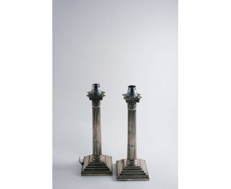 A PAIR OF EDWARDIAN CORINTHIAN COLUMN LAMP BASES each inscribed on the steps, by Hawkesworth, Eyre & co., Sheffield 1902 (loa