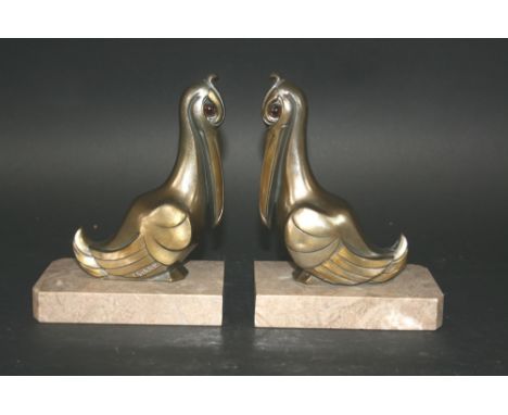 ART DECO BOOKENDS a pair of metal Pelicans signed Franjou, mounted on marble bases. Also with a pair of silver plated Bird bo