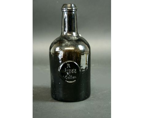 A SEAL BOTTLE the cylindrical body with a seal  R Bragg, So. Molton, base indistinctly moulded H. Ricketts & Co. Glassworks, 