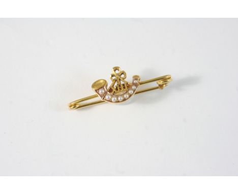 A GOLD AND PEARL REGIMENTAL BROOCH FOR PRINCE ALBERT'S SOMERSET LIGHT INFANTRY set with graduated small pearls, 4cm. long. In