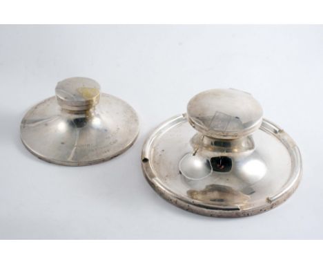 A LARGE CIRCULAR CAPSTAN INKWELL with pen rests around the border (glass liner), by A & J. Zimmerman, Birmingham 1916 and ano