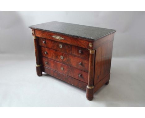 A LOUIS PHILIPPE MAHOGANY COMMODE with a grey speckled marble top above a long frieze drawer, with three long recessed drawer