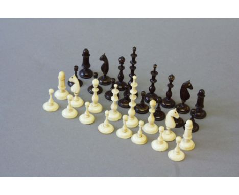 AN INDIAN BLACK &amp; WHITE IVORY CHESS SET&nbsp;king 3ins. (7.5cms.) high, it has been suggested that these are possibly Ger