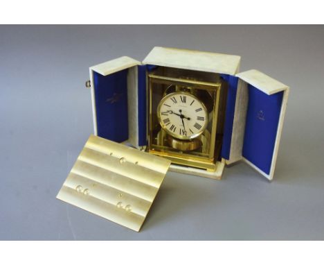 AN ATMOS GILT METAL MANTEL CLOCK dial cream signed Jaeger-LeCoultre, movement no.248433, together with a case and a wall brac