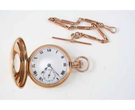 A 9CT. GOLD HALF HUNTING CASED POCKET WATCH the white enamel dial with Roman numerals and subsidiary seconds dial, 50mm., tog