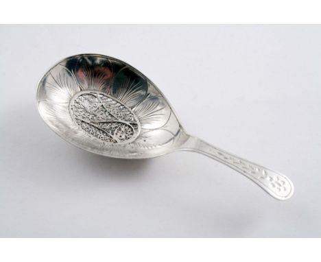 AN EARLY 19TH CENTURY ENGRAVED CADDY SPOON with an oval filigree panel in the bowl, struck only with a Dutch tax mark, 1800-1