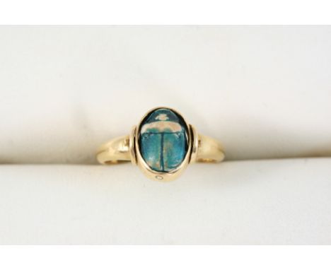 A SCARAB SWIVEL RING set in 18ct. gold. Size K.