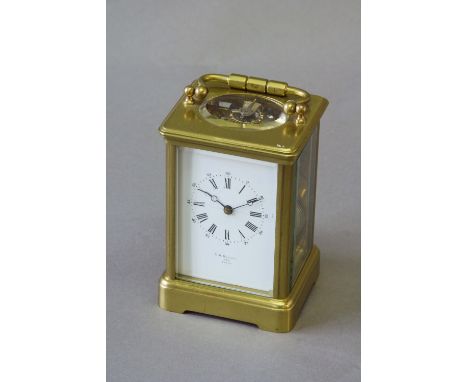 A CARRIAGE CLOCK dial white enamel, signed T R Russell, Paris, movement lever escapement striking on a gong, 51/4ins. (13.5cm
