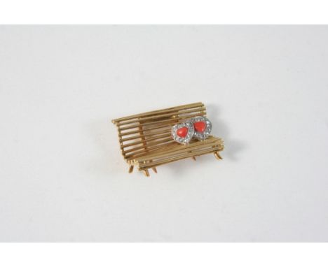 A CORAL, DIAMOND AND GOLD BENCH CLIP BY CARTIER the gold bench set with two coral hearts, within a surround of rose-cut diamo