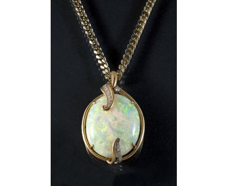 AN OPAL AND DIAMOND PENDANT set with a large oval shaped cabochon white opal, within a gold surround set with graduated circu