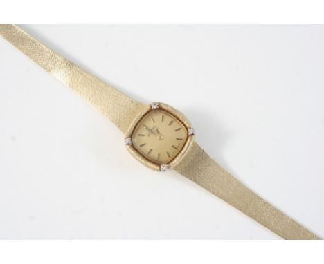 A LADY'S 9CT. GOLD AND DIAMOND WRISTWATCH BY ROTARY the signed cushion-shaped dial with baton numerals, with four circular-cu