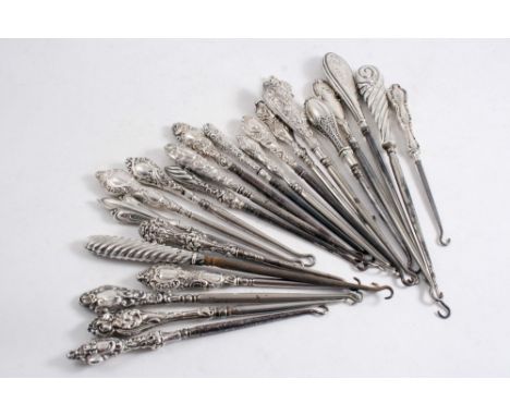 TWENTY THREE VARIOUS MOUNTED STEEL BUTTON HOOKS (late Victorian & later), mixed designs, makers & dates;  the longest one 8.8