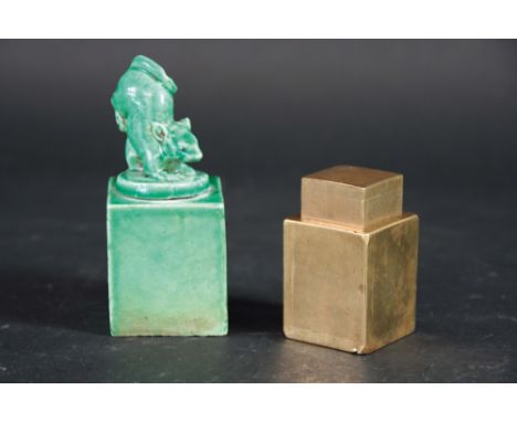 A CERAMIC SEAL with a squirrel finial, 4ins. (10cms.) high, together with a character engraved "dice" contained in a brass tw