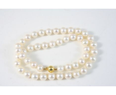 A SINGLE ROW UNIFORM CULTURED PEARL NECKLACE the pearls measure approximately 8.2mm., and are set to a 9ct. gold ball clasp, 