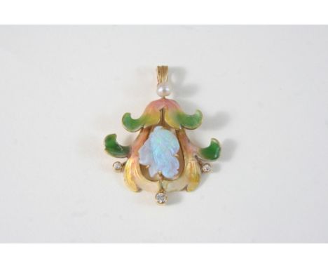 AN ART NOUVEAU ENAMEL, OPAL AND DIAMOND PENDANT the enamel foliate design is centred with a carved opal head, and set with th