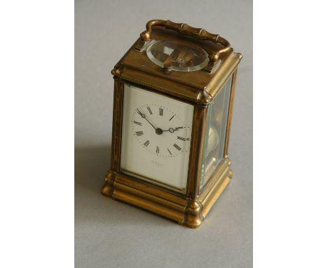 A CARRIAGE CLOCK dial white enamel, signed 'Geo Black, 392 Strand, London', movement cylinder escapement, striking on a gong,